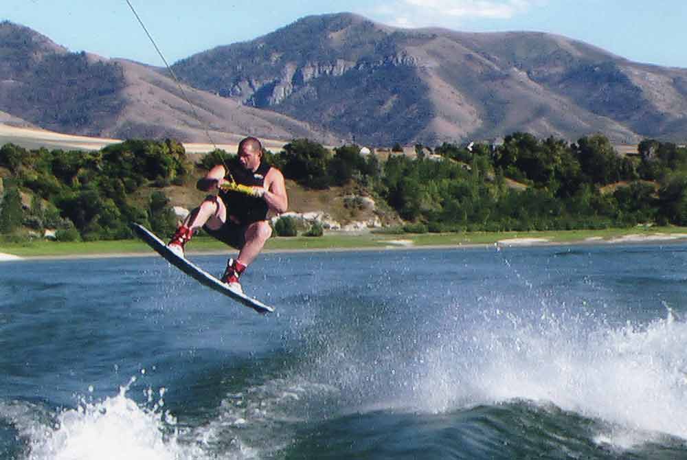 Rulon wakeboarding on a lake